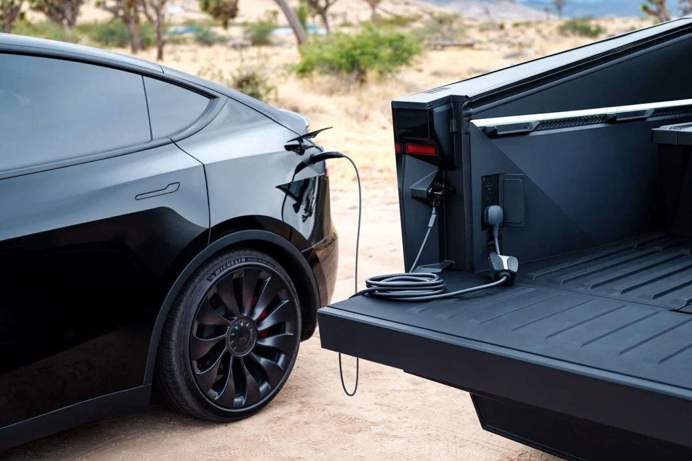 Tesla Cybertruck recharging a tesla